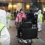 Passengers wearing protective face masks leave upon arrival at Chhatrapati Shivaji Maharaj International Airport after India cancelled all flights from the UK over fears of a new variant of the coronavirus disease (COVID-19), in Mumbai, India, December 22, 2020. REUTERS/Francis Mascarenhas/File Photo