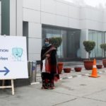 A woman stands outside a COVID-19 vaccination centre at the Max hospital amid the outbreak of the coronavirus disease (COVID-19) in New Delhi, India January 16, 2021.