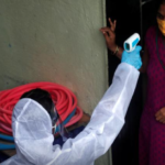 Healthcare worker in a Mumbai slum for a COVID-19 check-up camp. Photo: Reuters/Francis Mascarenhas 