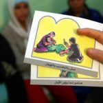 - PHOTO TAKEN 13JUN06 -A counsellor holds up cards used to educate women about female genital mutil..