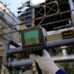A Geiger counter shows a radiation level of 231 microsieverts per hour near the damaged No. 3 reactor building at the tsunami-crippled Fukushima Daiichi nuclear power plant in Okuma town, Fukushima prefecture