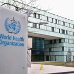 FILE PHOTO: A logo is pictured outside a building of the WHO in Geneva