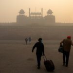 FILE PHOTO: People arrive to visit the Red Fort on a smoggy morning in the old quarters of Delhi, India