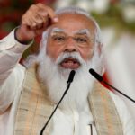 FILE PHOTO: India's PM Modi addresses a gathering before flagging off the "Dandi March", in Ahmedabad