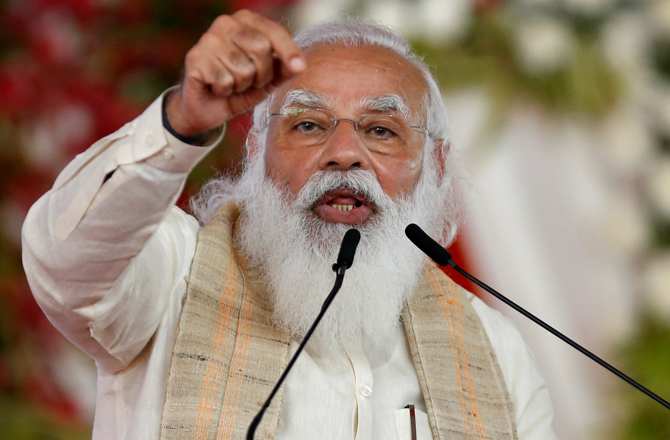 FILE PHOTO: India's PM Modi addresses a gathering before flagging off the "Dandi March", in Ahmedabad