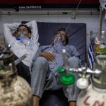 Patients suffering from the coronavirus disease (COVID-19) get treatment at the casualty ward in Lok Nayak Jai Prakash (LNJP) hospital, amidst the spread of the disease in New Delhi
