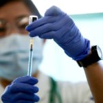 A medical worker fills a syringe with a dose of the Pfizer-BioNTech coronavirus disease (COVID-19) vaccine as Japan launches its inoculation campaign, at Tokyo Medical Center in Tokyo