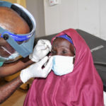 Surgeon Dahiru Abdulkadir removes TT patient Salamatu Abdulaziz's sutures