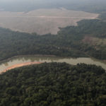 FILE PHOTO: An aerial view shows a river and a deforested plot of the Amazon near Porto Velho