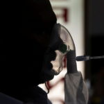 A patient suffering from the coronavirus disease (COVID-19) receives treatment inside the emergency ward at Holy Family hospital in New Delhi