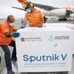 FILE PHOTO: Workers take care of the shipment of Russia's Sputnik V vaccine at the airport, in Caracas