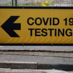 A sign directing people to a testing station, amid the outbreak of the coronavirus disease (COVID-19) in Bolton, Britain