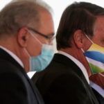 FILE PHOTO: Brazil's Queiroga and Bolsonaro (left and center) attend a ceremony in Brasilia