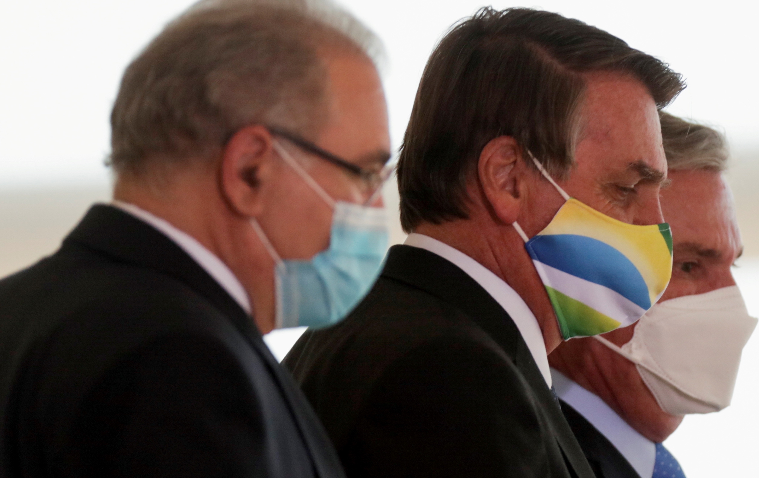 FILE PHOTO: Brazil's Queiroga and Bolsonaro (left and center) attend a ceremony in Brasilia