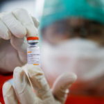 FILE PHOTO: A medical worker holds a dose of the Sinovac vaccine at a district health facility as Indonesia begins mass vaccination for the coronavirus disease (COVID-19), in Jakarta