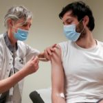 FILE PHOTO: A volunteer receives a dose of CureVac vaccine or a placebo, in Brussels