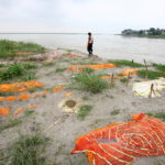 Monsoon exposes bodies buried in shallow sand graves in Phaphamau