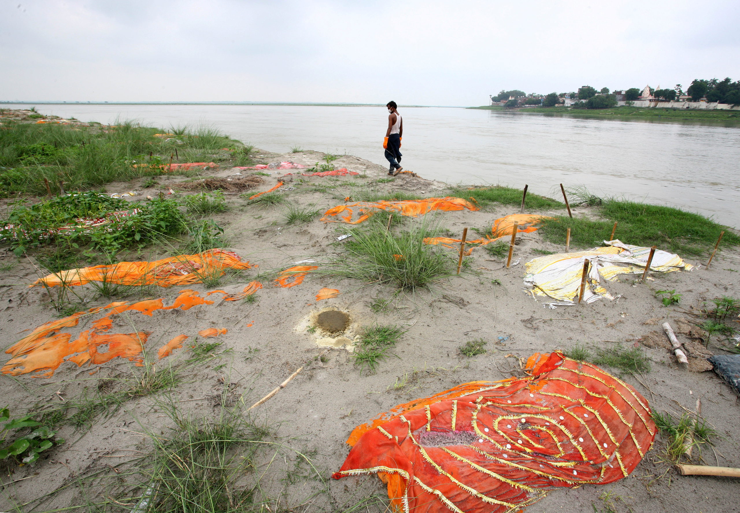 Monsoon exposes bodies buried in shallow sand graves in Phaphamau