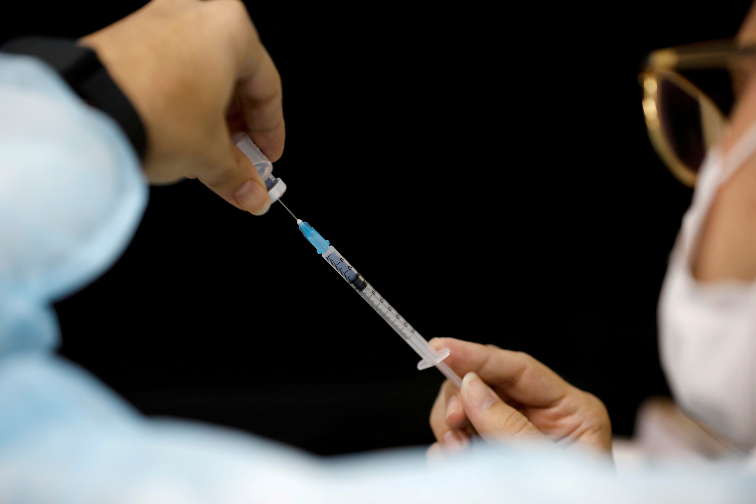 FILE PHOTO: A medical worker prepares to administer a vaccination against the coronavirus disease (COVID-19) as Israel continues its national vaccination drive, during a third national COVID lockdown, in Ashdod