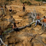 FILE PHOTO: Indigenous people from the Mura tribe show a deforested area in unmarked indigenous lands inside the Amazon rainforest near Humaita