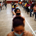 FILE PHOTO: Coronavirus disease (COVID-19) vaccination in Praxedis G. Guerrero