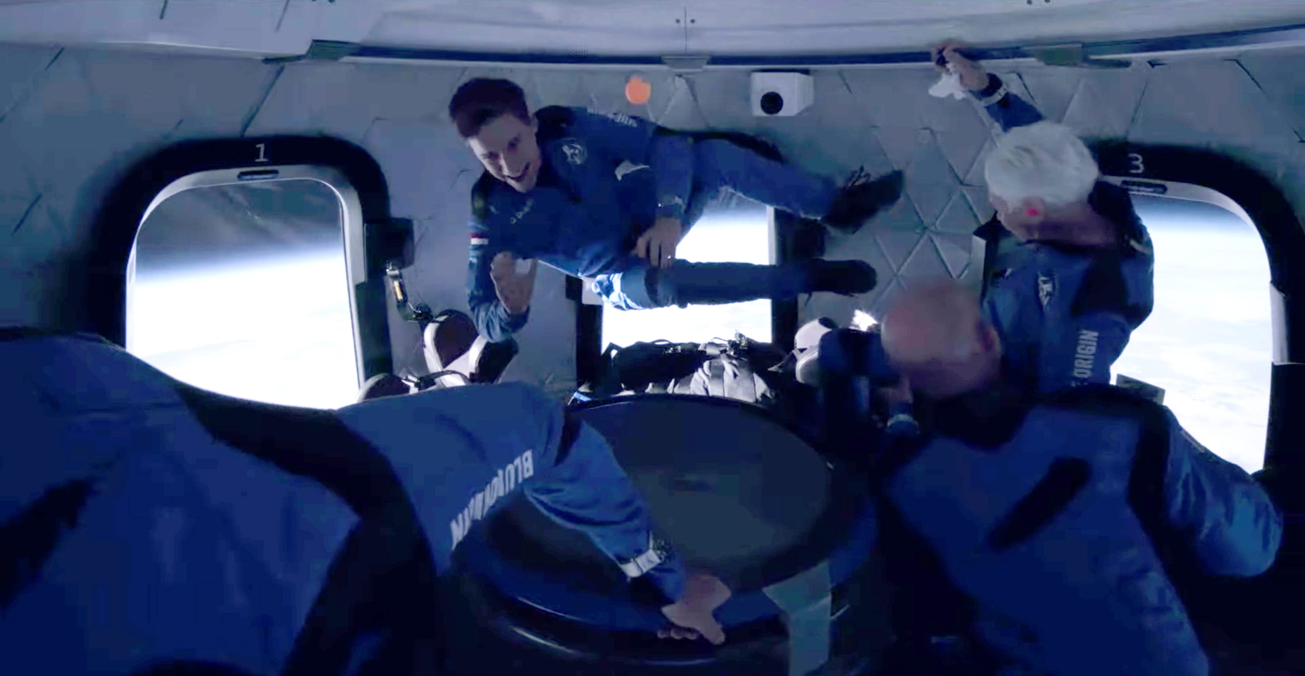 Recent Dutch high school graduate Oliver Daemen and pioneering female aviator Wally Funk float weightlessly