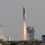 Billionaire businessman Jeff Bezos is launched with three crew members aboard Blue Origin's New Shepard rocket