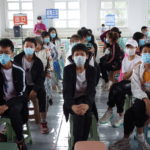 Residents wait at the observation area during a COVID-19 vaccination session in Heihe