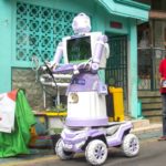 Aseyanto, 53, a resident of the Tembok Gede neighbourhood, operates the "Delta Robot", made from household items like pots, pans and an old television monitor, in Surabaya