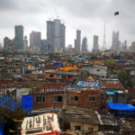 FILE PHOTO: Bird flies across central Mumbai's financial district skyline