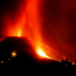 Lava and smoke rise following the eruption of a volcano on the Canary Island of La Palma