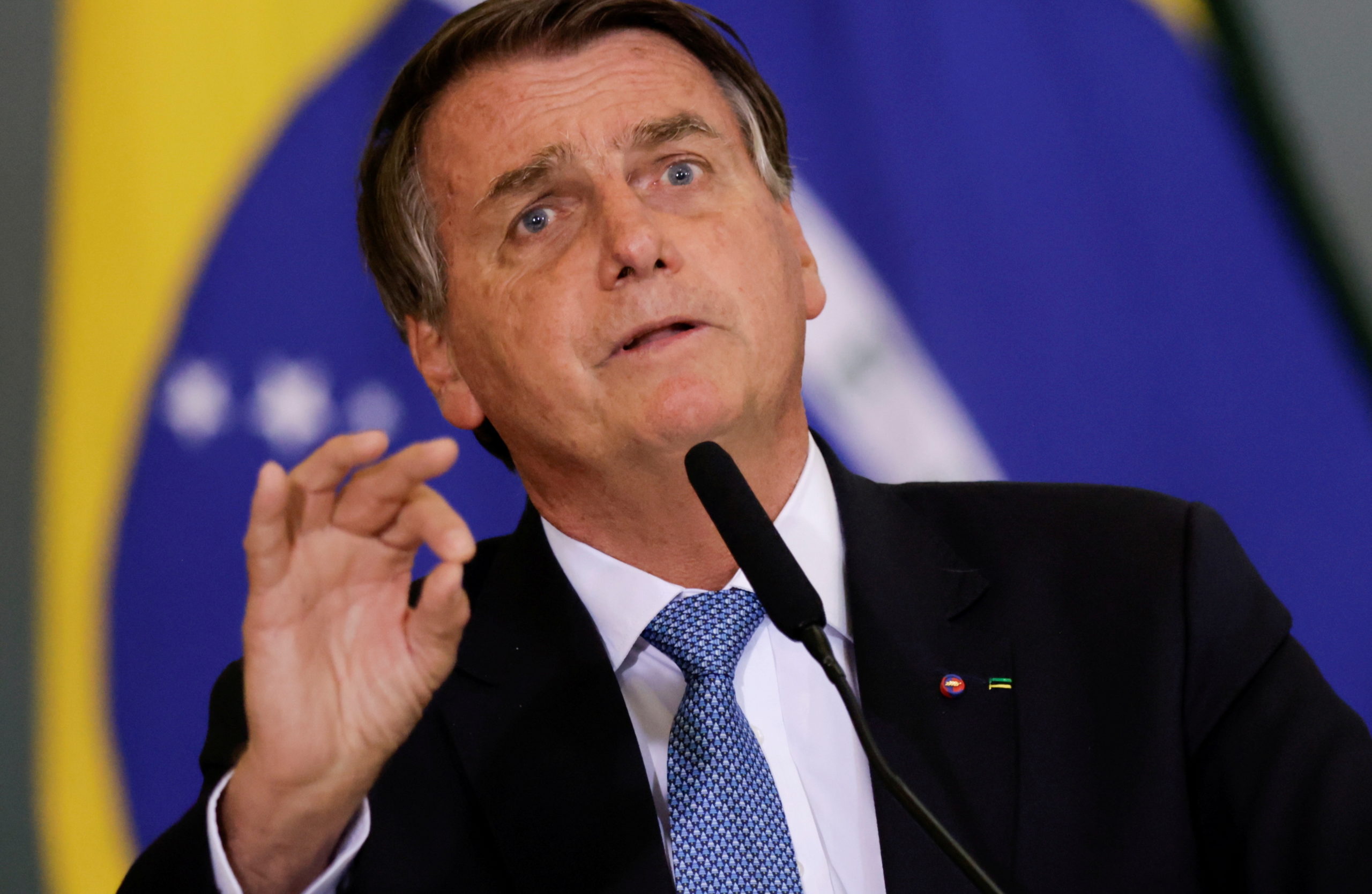 FILE PHOTO: Brazil's President Jair Bolsonaro attends the ceremony for the Modernization of Occupational Health and Safety Regulations, in Brasilia