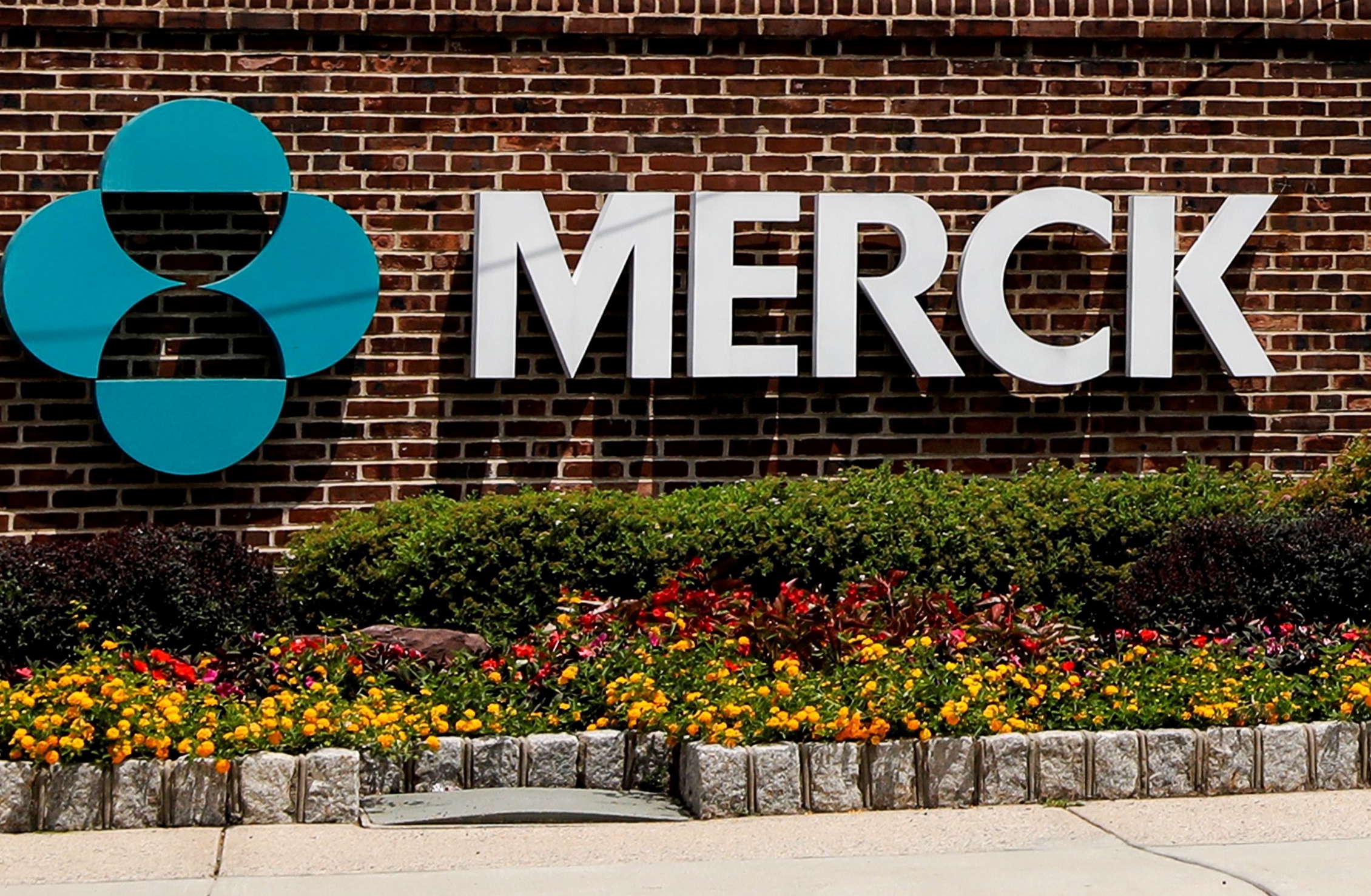 FILE PHOTO: The Merck logo is seen at a gate to the Merck & Co campus in Rahway, New Jersey