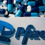 FILE PHOTO: A 3D printed Pfizer logo is placed near medicines from the same manufacturer in this illustration