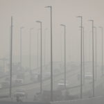FILE PHOTO: Traffic moves on a flyover on a smoggy morning in New Delhi