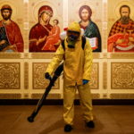 FILE PHOTO: A specialist sanitizes a railway station amid the outbreak of the coronavirus disease in Moscow