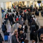 FILE PHOTO: Passengers travelling at Newark Liberty International Airport in Newark