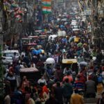 People shop at a crowded market amidst the spread of the coronavirus disease (COVID-19), in the old quarters of Delhi