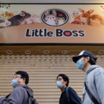 People stand in front of a closed pet shop after the government announced to euthanize around 2,000 hamsters in the city after finding evidence for the first time of possible animal-to-human transmission of coronavirus disease (COVID-19) in Hong Kong