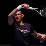 Serbian tennis player Novak Djokovic practices at Melbourne Park as questions remain over the legal battle regarding his visa to play in the Australian Open
