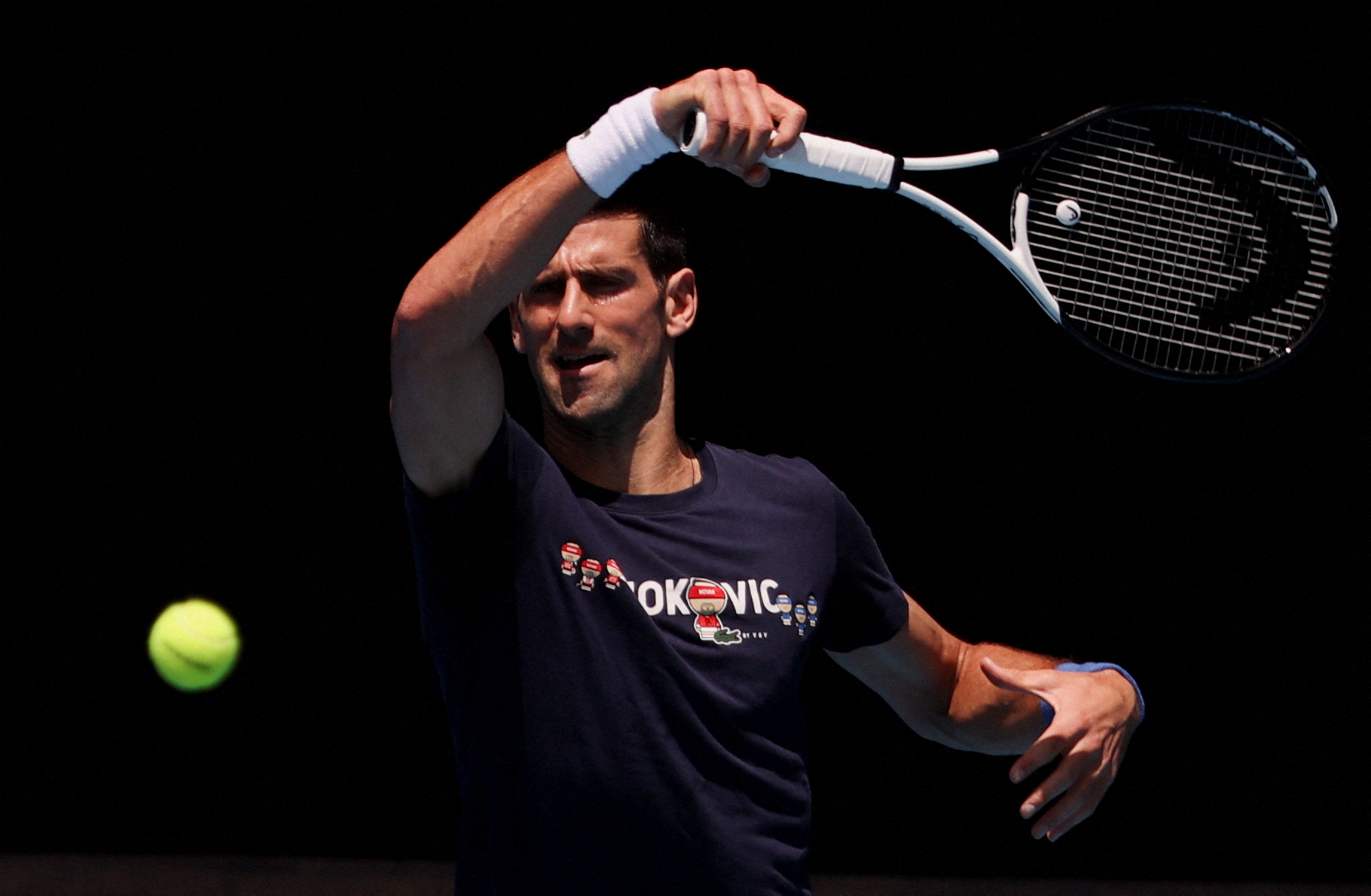Serbian tennis player Novak Djokovic practices at Melbourne Park as questions remain over the legal battle regarding his visa to play in the Australian Open