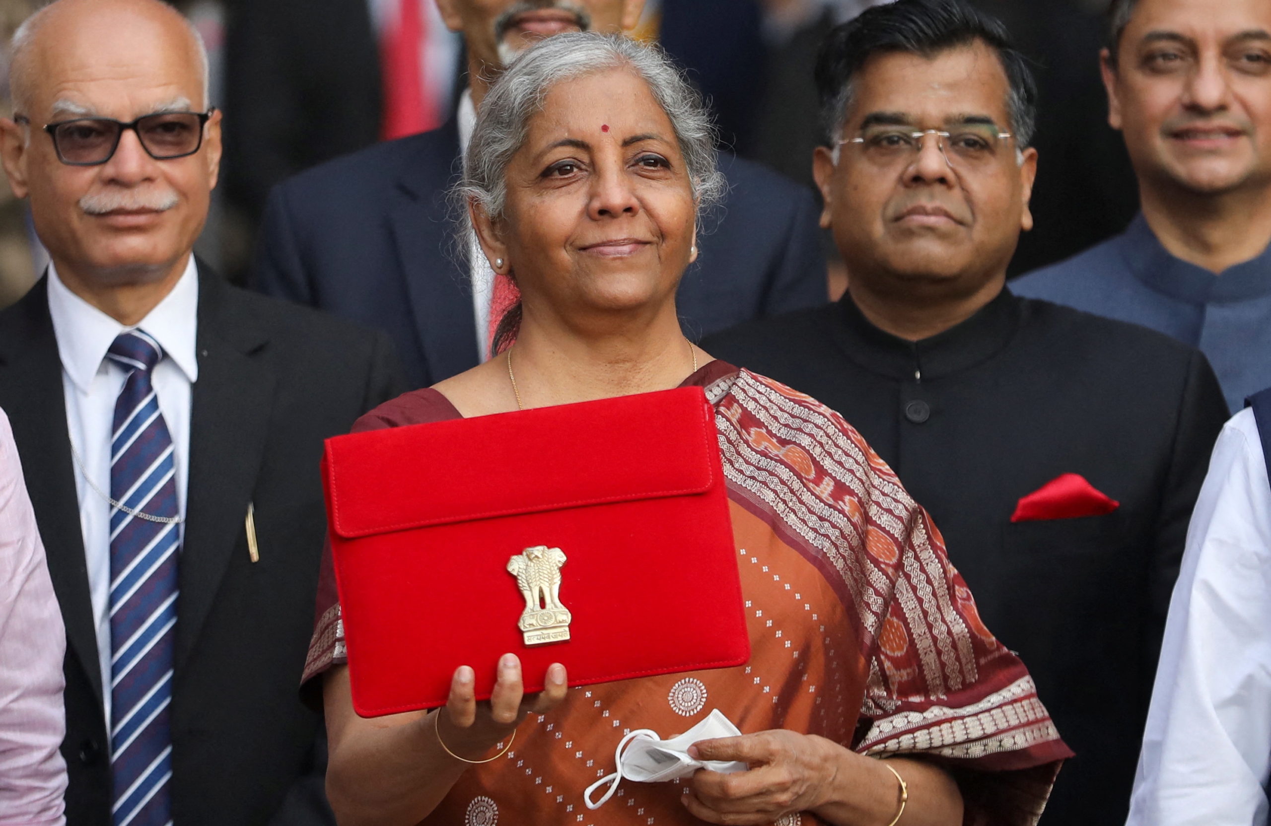 India's Finance Minister Nirmala Sitharaman holds up a folder with the Government of India’s logo