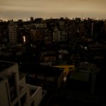 Houses and buildings are seen in an electric stoppage at the area after an earthquake at Toshima ward in Tokyo