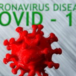 FILE PHOTO: A 3D-printed coronavirus model is seen in front of the words coronavirus disease (Covid-19) on display in this illustration