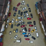 Aerial view shows vehicles submerged in flood waters in Shah Alam