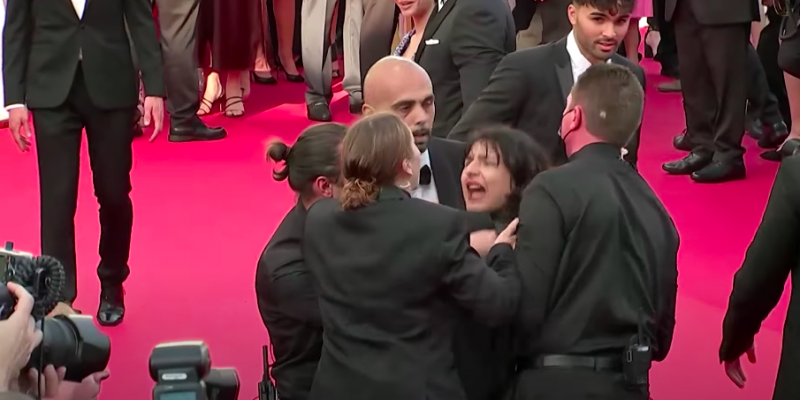 'Stop Raping Us': Protester Painted in Ukraine Colours Storms Cannes Red Carpet - Vimarsana News
